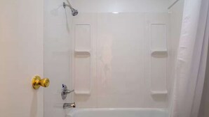 A bathroom with a bathtub, a shower, and a toilet. - Queen Suite #10 at Glory Dayz (Eureka Springs)