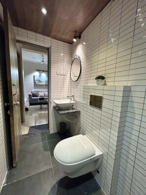 Superior Apartment, Hill View | Bathroom | Shower, free toiletries, hair dryer, bidet - StayLeisurely Boutique suites Lonavala (Lonavala)