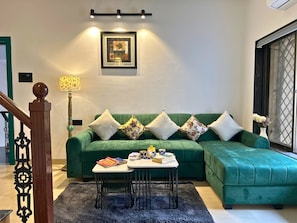 Executive Apartment, 3 Bedrooms | Living room | 40-inch Smart TV with digital channels - StayLeisurely Boutique suites Lonavala (Lonavala)