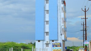 A multi-story building with a sign indicating "RR RESIDENCY AC / NON AC ROOMS". - RR RESIDENCY RANIPET (Walajapet)