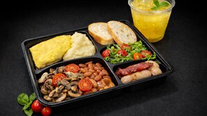 A meal with eggs, toast, beans, mushrooms, tomatoes, sausages, and a glass of juice. - UHF HOTELS & RESORTS PINETREE (Iskandar Puteri)
