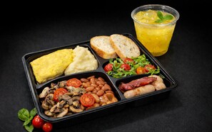 A meal with eggs, toast, beans, mushrooms, tomatoes, sausages, and a glass of juice. - UHF HOTELS & RESORTS PINETREE (Iskandar Puteri)