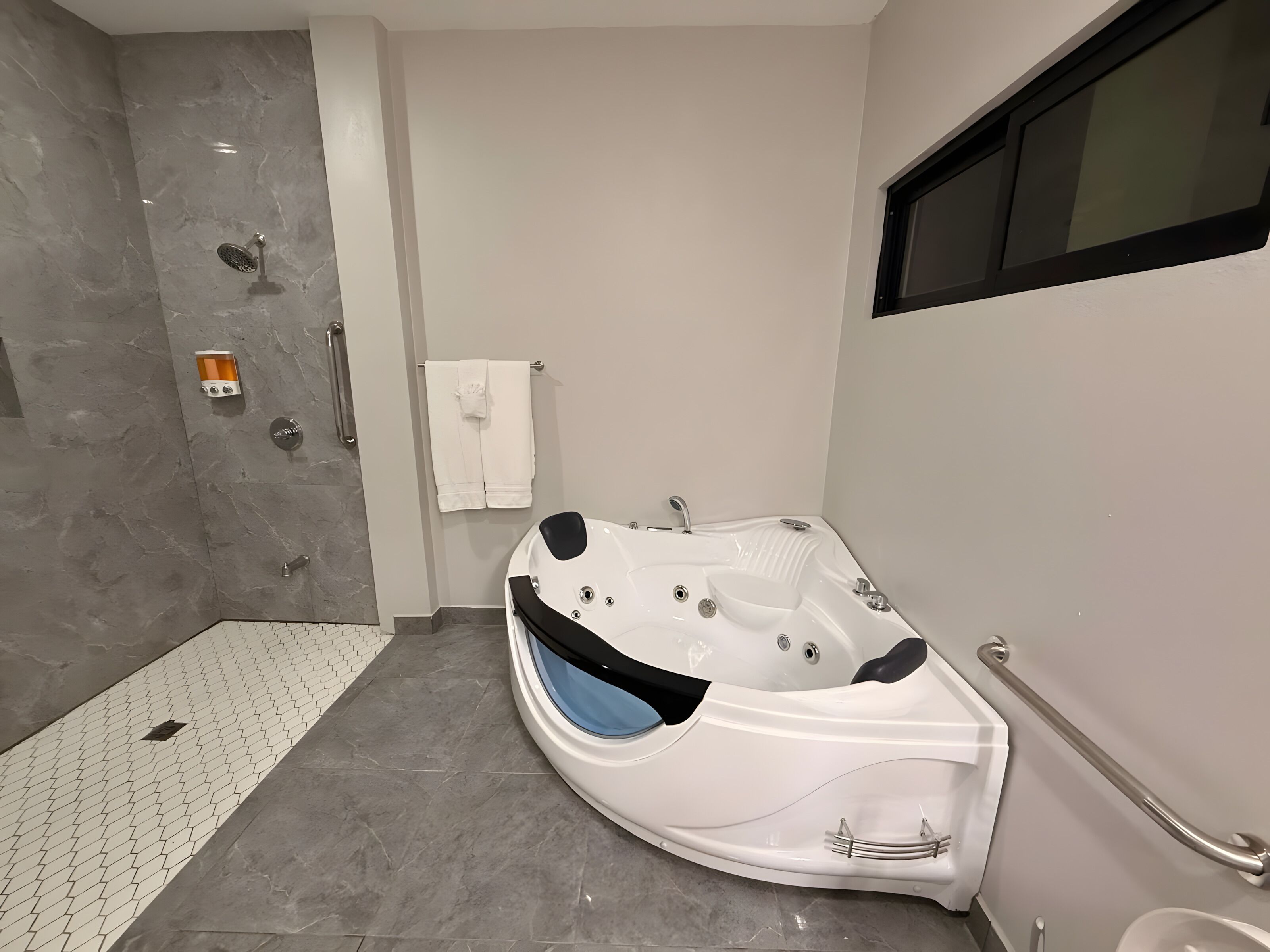 Jetted tub, hair dryer, towels, soap