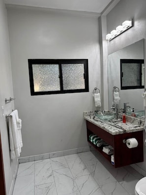 Shower, hair dryer, towels, soap