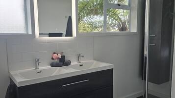 Shower, hair dryer, towels, soap