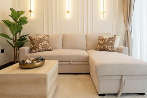 Deluxe Apartment, City View | Living area | 150-inch Smart TV with satellite channels, Netflix, streaming services
