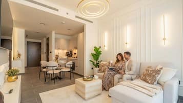 Deluxe Apartment, City View | Living area | 150-inch Smart TV with satellite channels, Netflix, streaming services