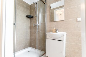 Shower, hair dryer, towels, soap