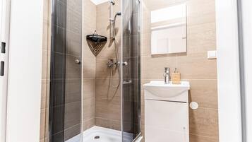 Shower, hair dryer, towels, soap