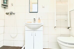 Shower, hair dryer, towels, soap