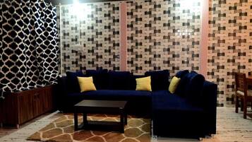 Deluxe Villa, Lake View | Living area | TV