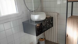 Shower, towels, soap, toilet paper