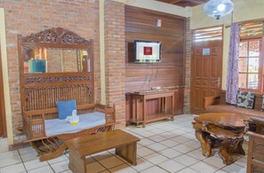 Premier Room, 5 Bedrooms | Living area | 20-inch flat-screen TV with cable channels