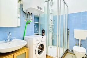 Shower, hair dryer, towels, soap