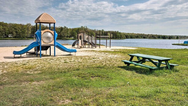 A playground with a slide and climbing structure near a lake. - < 1 Mi to Lake: Family Home in Albrightsville! (Albrightsville)