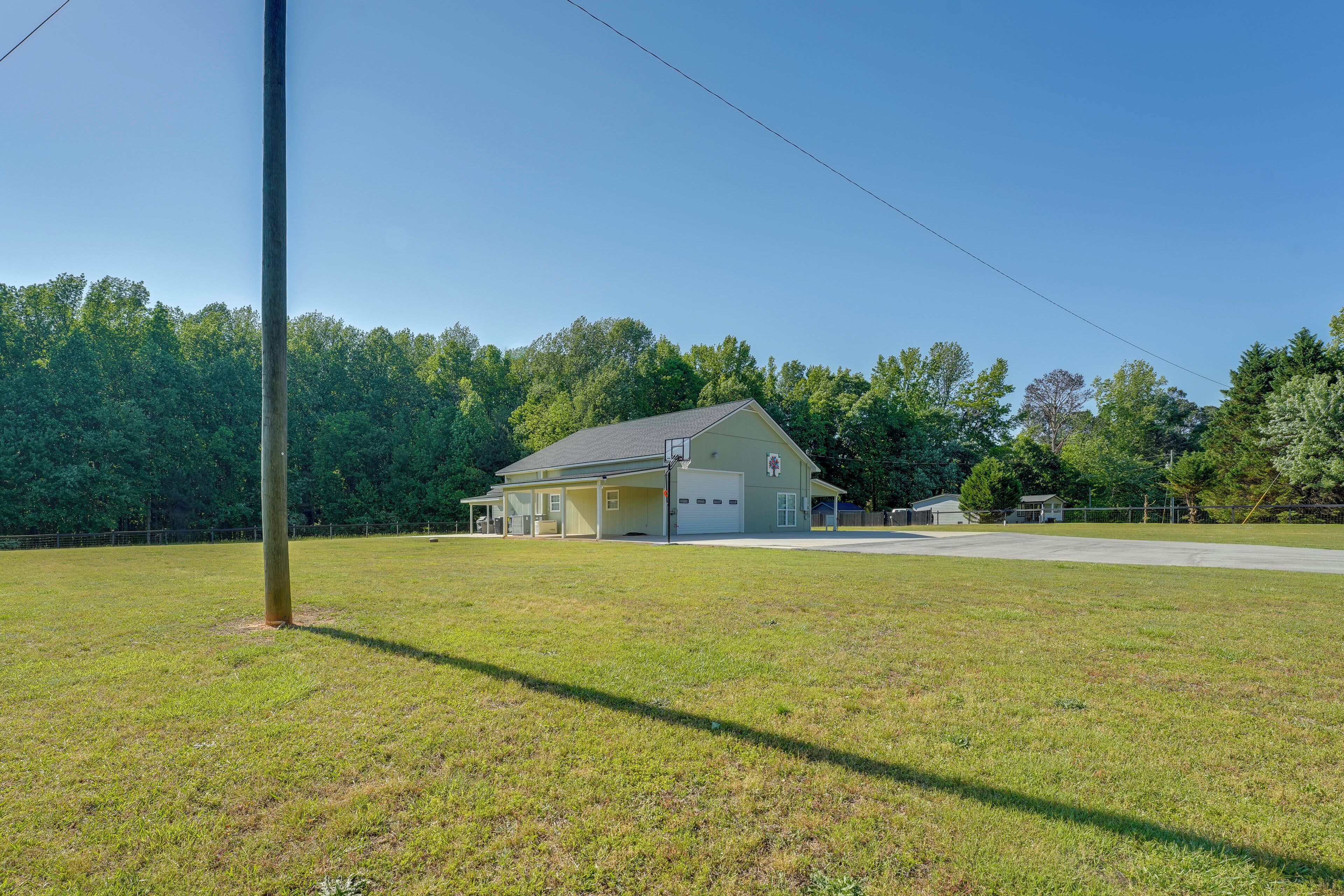A single-story house with a garage, a front porch, and a driveway.