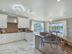 Fridge, microwave, oven, stovetop - Pool and canal front home in Palm Coast! (Palm Coast)