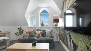 Apartment (Group Getaway – Stylish 2-Bed Cardi) | Living room | Flat-screen TV