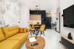 TV, offices - Al. Kopisto 11 Rzeszów | Black and Yellow Apartment with Air Conditioned Living (Rzeszów)