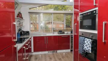 Fridge, microwave, toaster, cookware/dishes/utensils