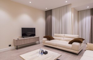 Deluxe appartement, 1 slaapkamer | Verduisterende gordijnen, een strijkplank/strijkijzer, gratis wifi