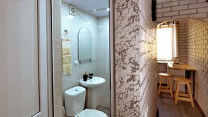 A bathroom with a toilet, sink, and shower area. - KAYARAN home (Gyumri)