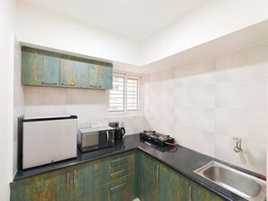 Luxury Apartment, Balcony, City View | Private kitchen | Fridge, microwave, stovetop, cookware/dishes/utensils
