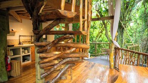 A wooden staircase with a natural, rustic design leading to a covered outdoor area. - Treehouse de Valentine Mountain Resort (Balamban)