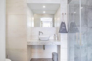 Shower, hair dryer, towels, soap