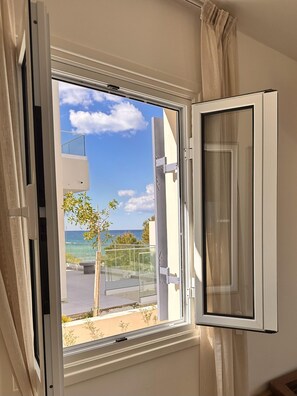 A window with an open view to a balcony overlooking a clear sky and a body of water. - Villa Astrofegia | Moonlit Escape with Sea Views (Polis)