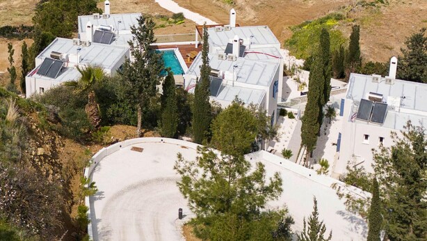 A coastal property with multiple buildings, a swimming pool, and a view of the sea. - Villa Paradise | Coastal Calm at Moonlight Villas (Polis)