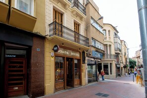A street with buildings, including a shop named BOADA RIERA. - Boada Riera (Terrassa)