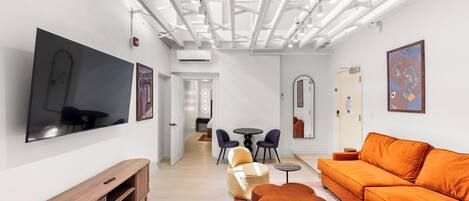 Chambre Junior | Coin séjour