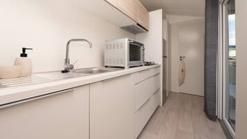 Fridge, microwave, stovetop, coffee/tea maker