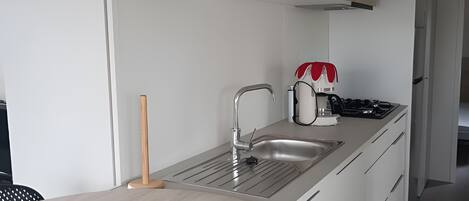 Fridge, microwave, stovetop, coffee/tea maker