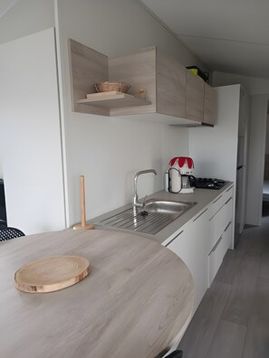 Fridge, microwave, stovetop, coffee/tea maker