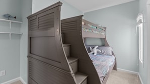 A bedroom with a four-poster bed, a window, and a small shelf with a fish decoration. - A Seaside Serentiy in Morehead City (Morehead City)