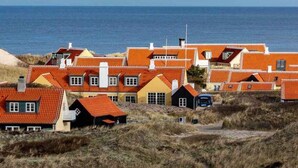 A coastal village with traditional red-roofed houses. - 5 Star Holiday Home in Skagen (Skagen)
