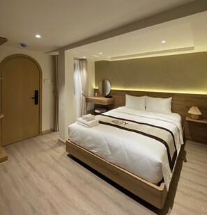 In-room safe, desk, blackout drapes, soundproofing - The Cozy Nest 2 - Thao Dien (Thu Duc)