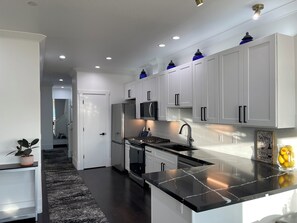 Fridge, microwave, oven, stovetop -  Charming and Spacious 4-bedroom house in  Pittsburg with AC (Pittsburg)