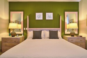 A double bed with two nightstands, each with a lamp and a clock. There are two framed pictures on the wall above the bed. - 3BR~Beach~ Escape @Terrenas+Pool +Family+Balcones (El Limón)