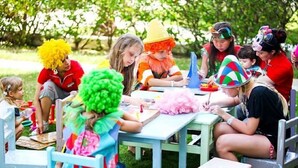 A group of people seated at tables outdoors, engaged in various activities. - El Mouradi Mahdia (Mahdia)