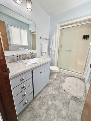 Shower, hair dryer, towels, soap