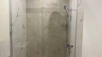 Shower, towels, soap, toilet paper