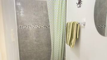 Shower, hair dryer, towels, toilet paper