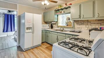 Fridge, microwave, stovetop, cookware/dishes/utensils