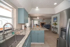 Microwave, oven, stovetop, dishwasher - Space Coast Waterfront Heated Pool Home (Merritt Island)