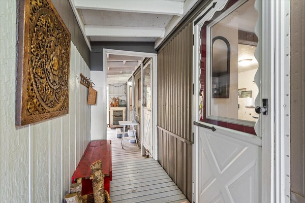 Entrance door on the side of the home with a keypad lock.