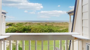 A balcony with a view of the beach and ocean. - Wonderful Third-Floor Condo in Oceanfront Complex w/Shared Pools & Hot Tub, WiFi (Atlantic Beach)