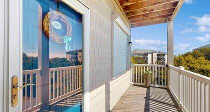 Sound side condo with sunset view balcony - close to pool, hot tub, and pier